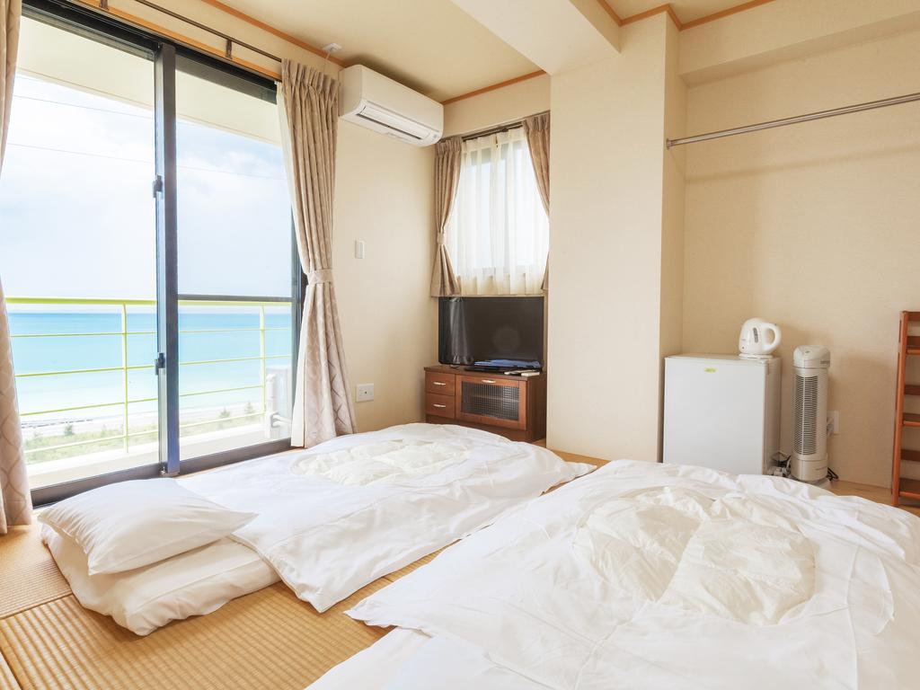 Kariyushi Condominium Ocean Hills Chouraku Stay Kin Exterior photo